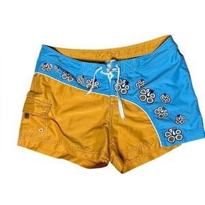 O'Neill Blue and Yellow board Shorts with Floral Design